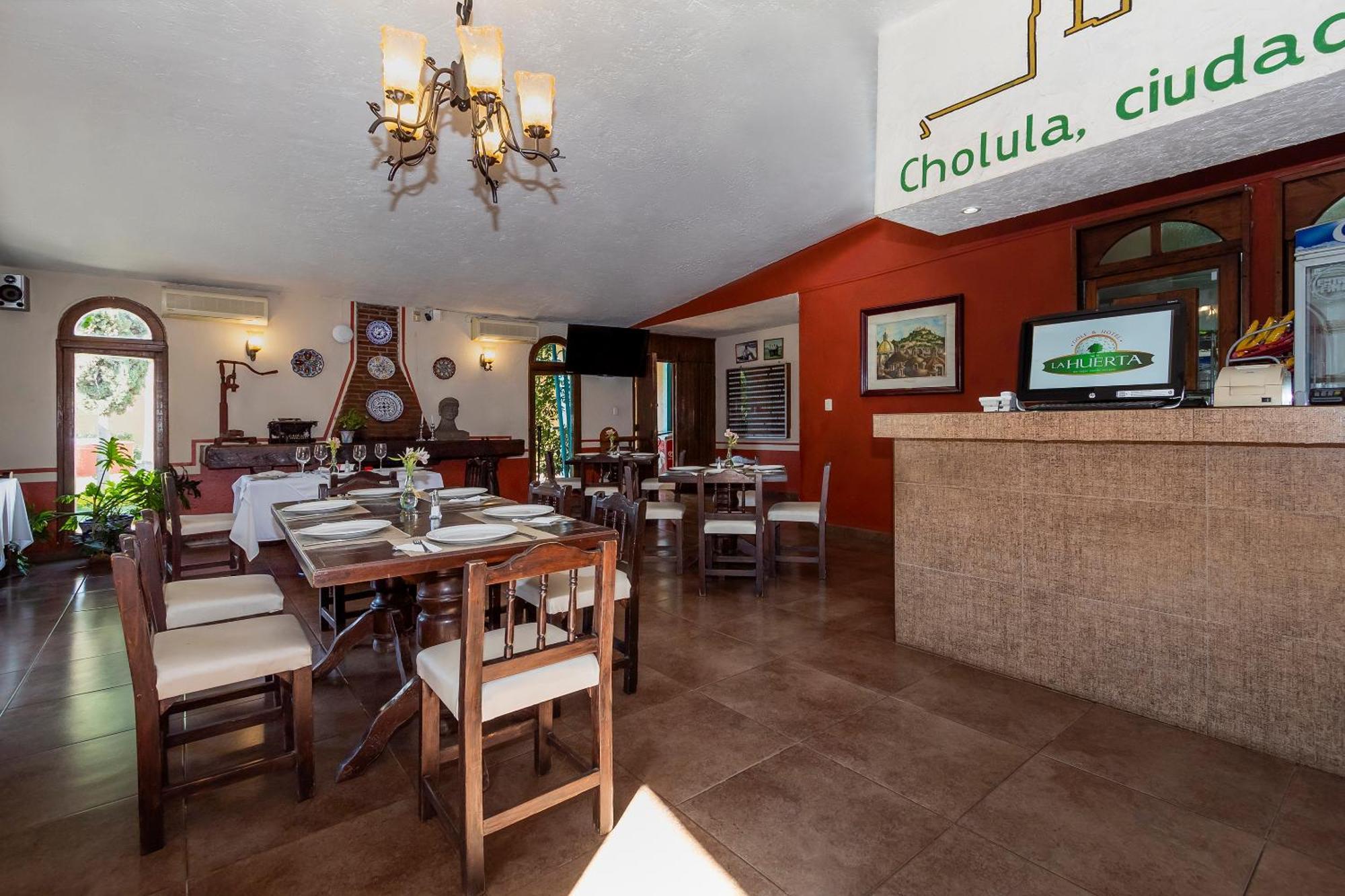 Capital O La Huerta Golf & Hotel Cholula Bagian luar foto